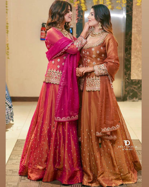 "Front view of ready-to-wear embroidered lehenga outfit with detailed sequins and moti work on simmer silk fabric, complemented by a matching orgenza dupatta."
