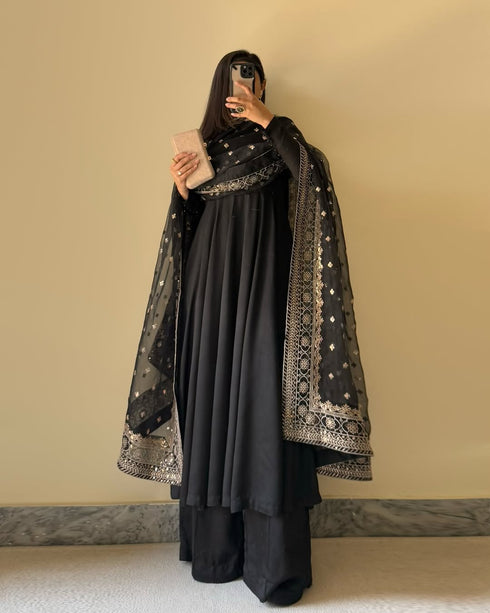Front view of Black Floral Cotton Suit with Pure Fox Georgette kurta, embroidered dupatta, and micro cotton palazzo.