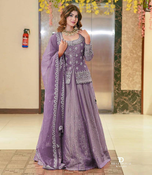 "Full view of heather-colored lehenga outfit featuring rich embroidery, flared skirt, and sheer dupatta – stitched and ready for festive occasions"
