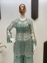 Detailed view of the micro-fabric blouse included in the Capri set